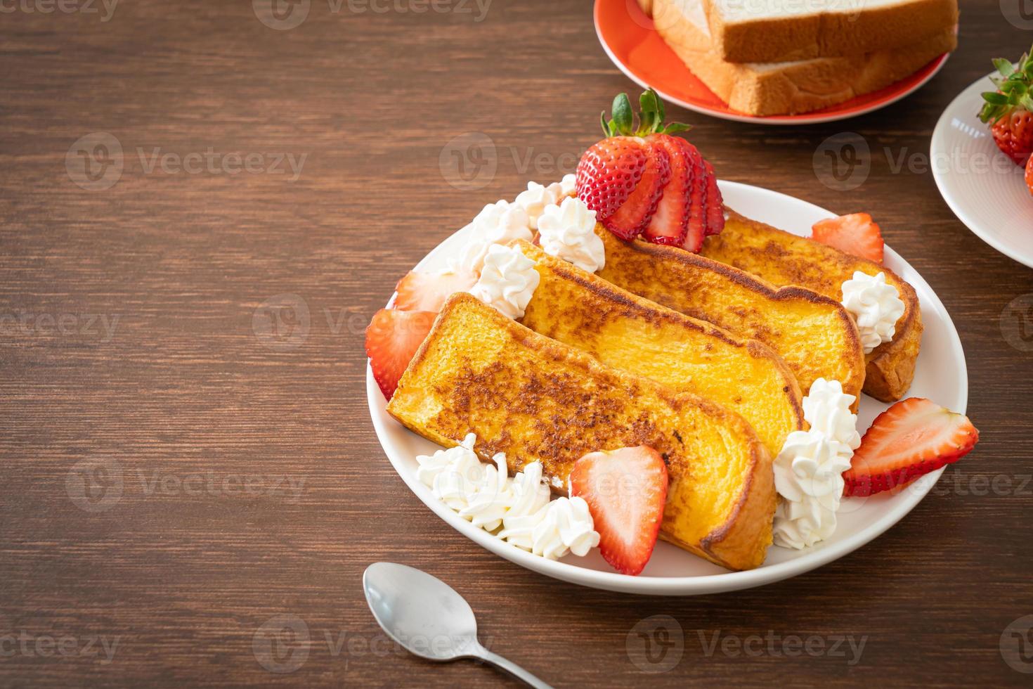 french toast with fresh strawberry and whipping cream photo