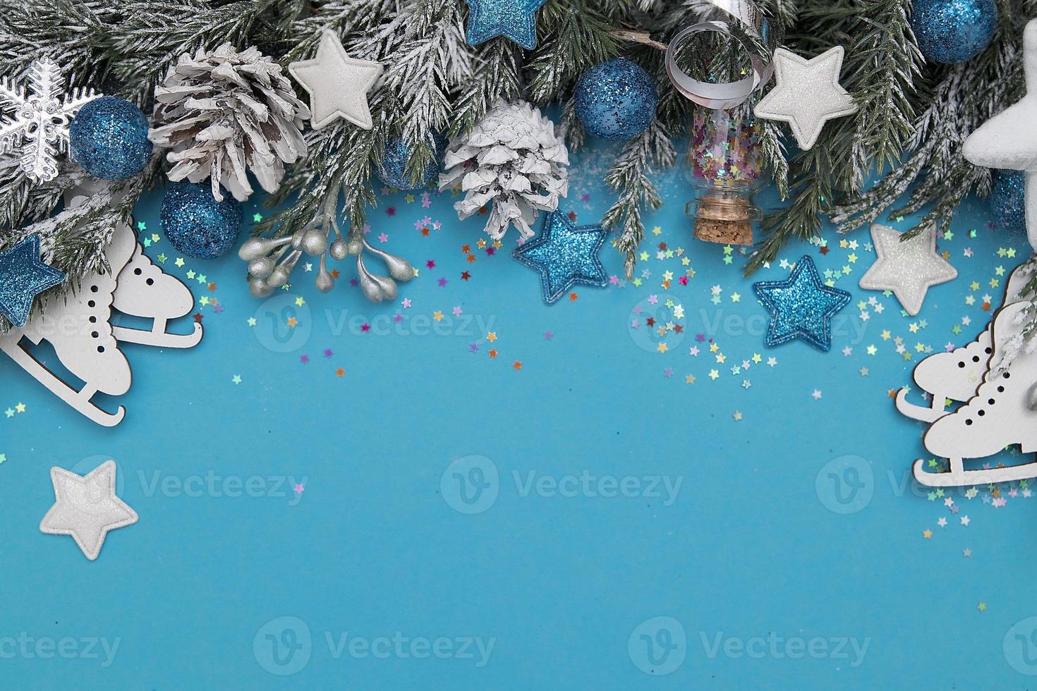 Winter holiday decoration card festive concept Christmas trees, stars, skates and balls on blue background photo
