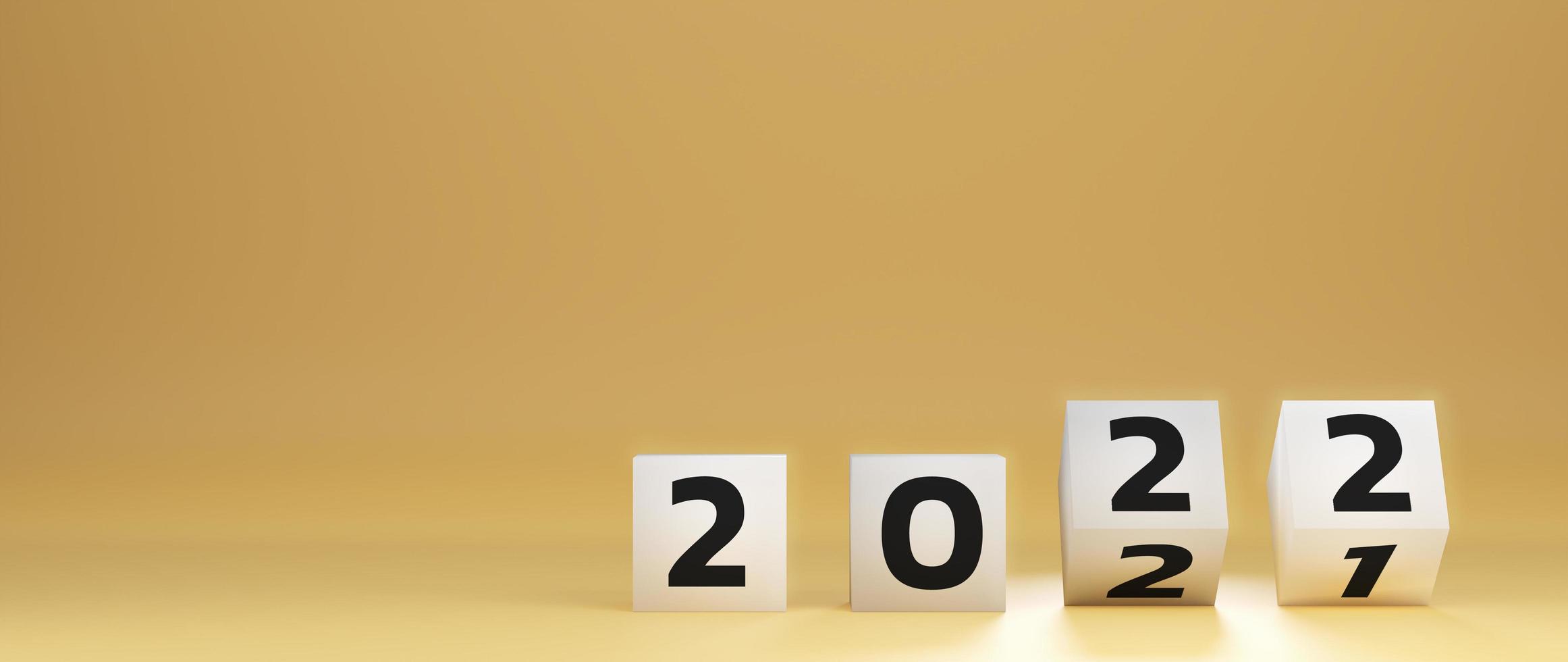 start to year 2022. white cube block flipping to change 2021 year to 2022 year on yellow background with copy space. happy new years concept. 3D Render Illustration. photo