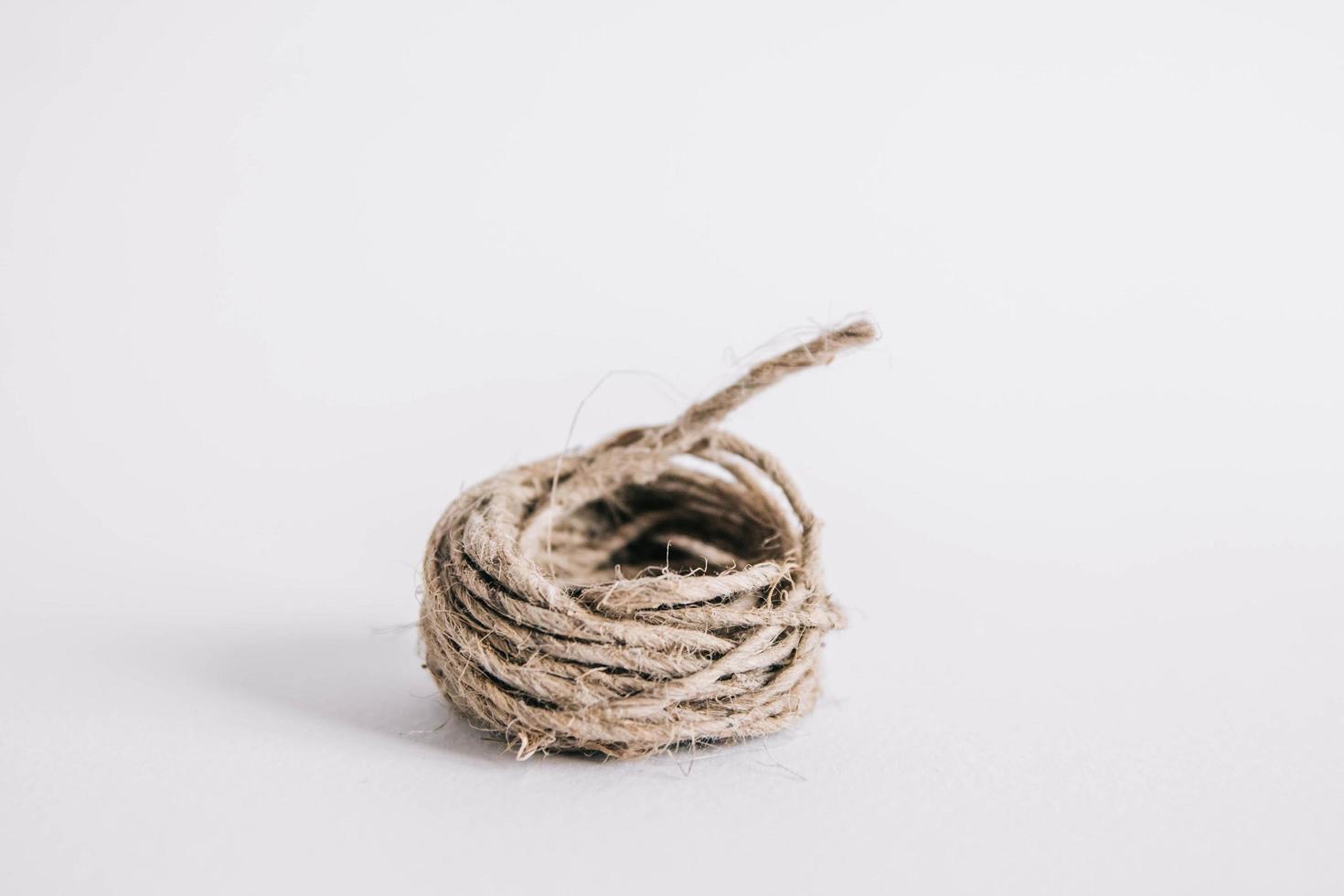 Kraft brown twine on the white background photo