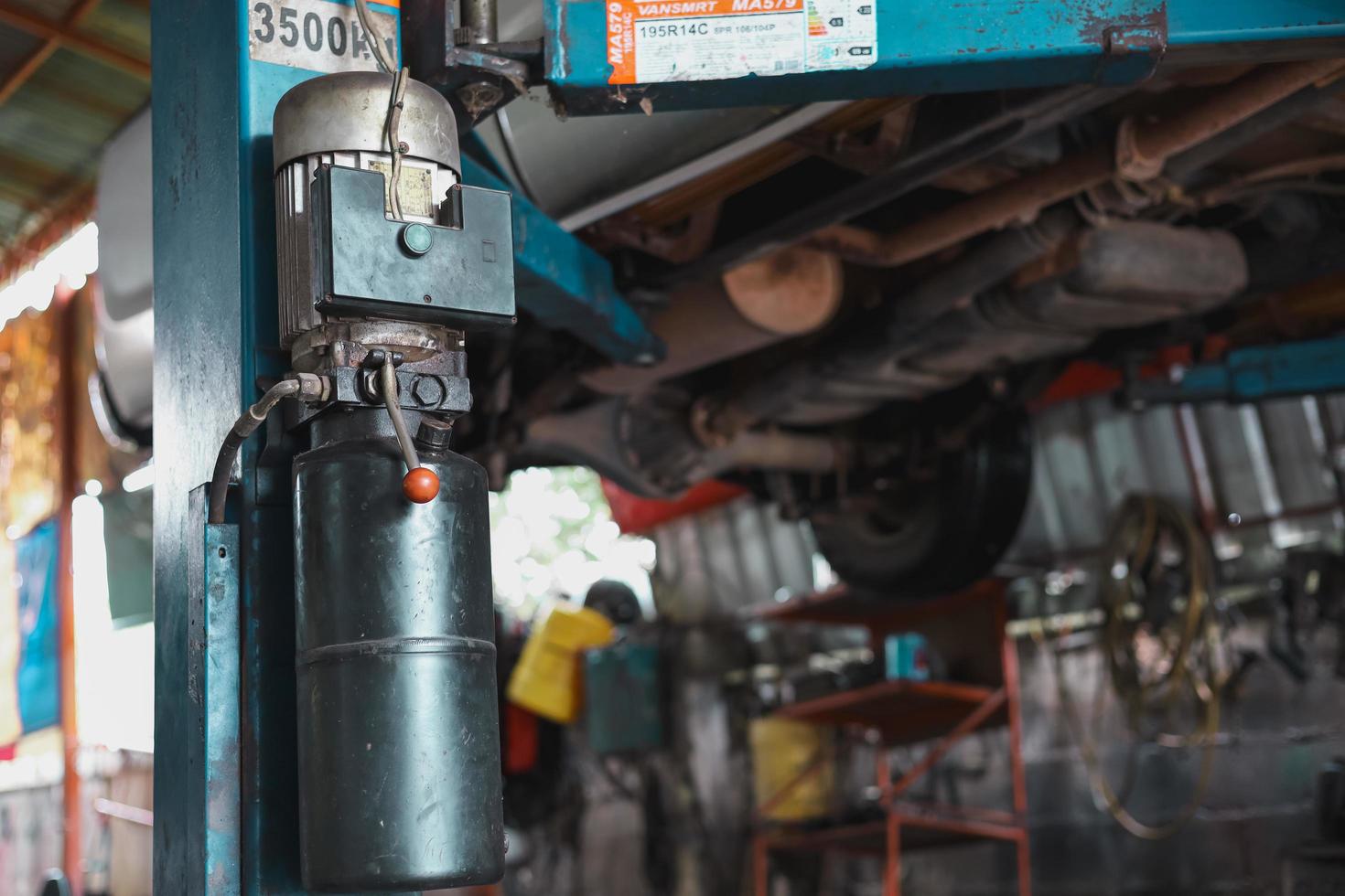 Hydraulic lift car for checking the suspension to make repairs. photo