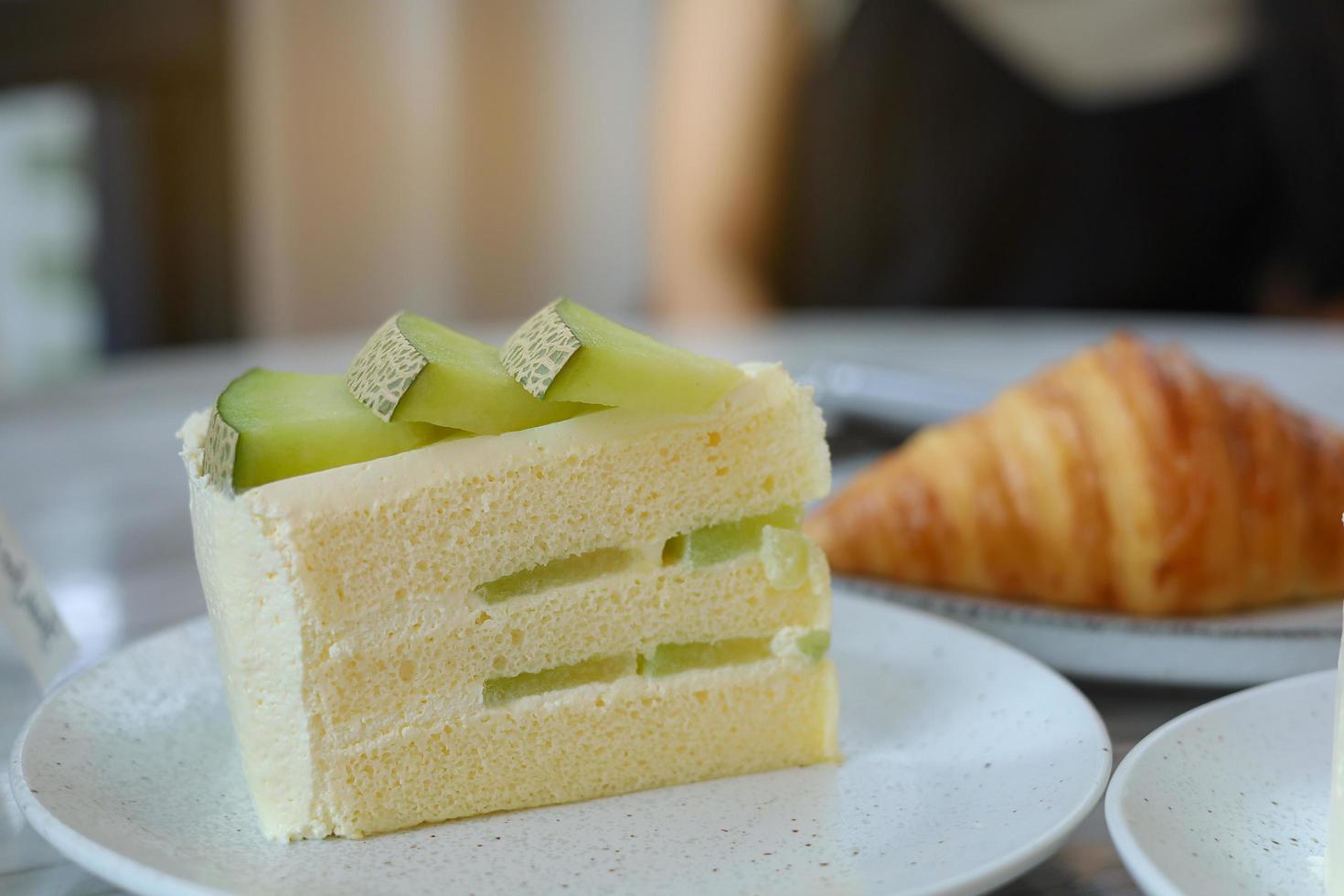 Melon cake with melon slices decorated on top photo