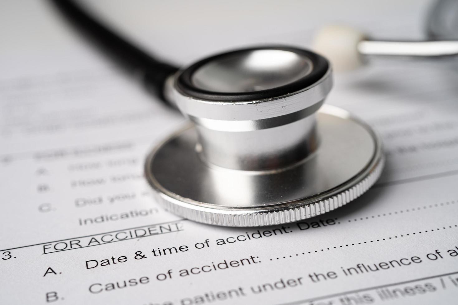 Health insurance accident claim form with stethoscope, Medical concept. photo