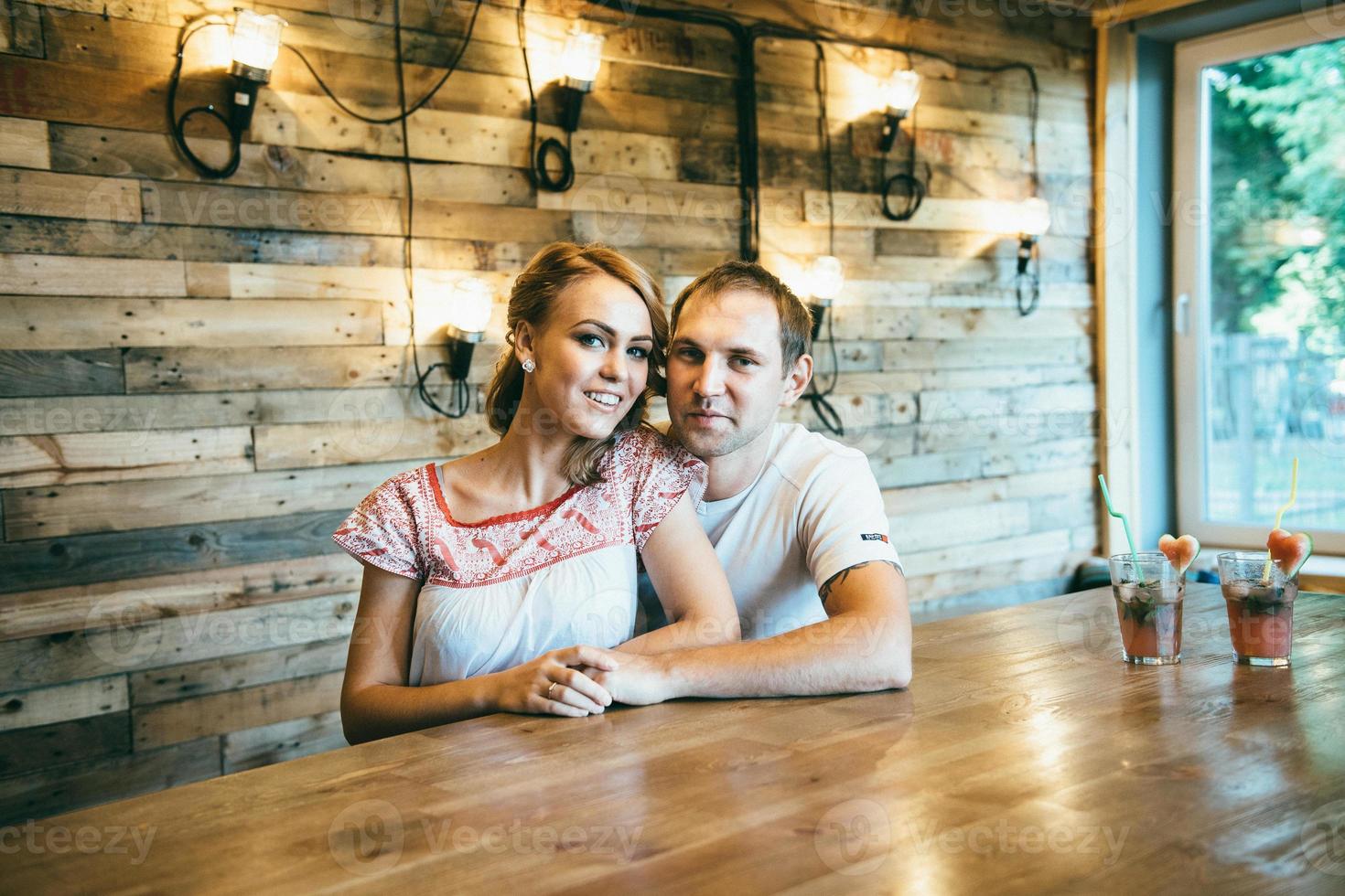 guy and a girl meeting in a city cafe photo