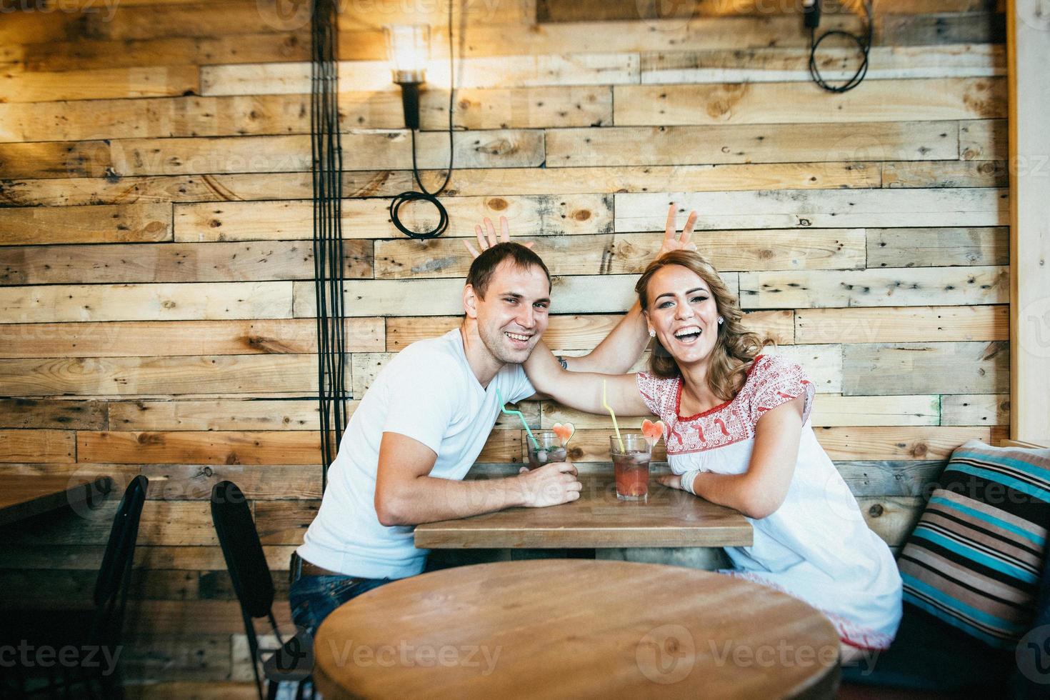 guy and a girl meeting in a city cafe photo