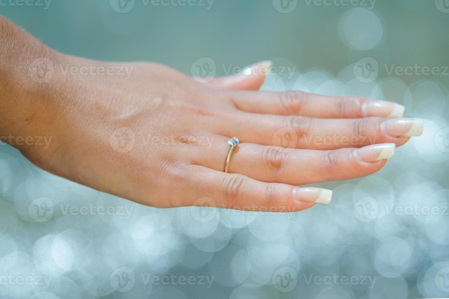 wedding ring on the girl's finger photo
