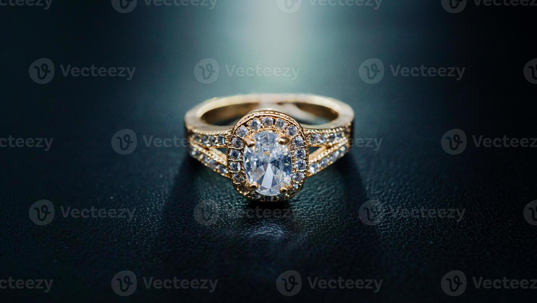 Photo of womens gold ring decorated with a sparkling diamond