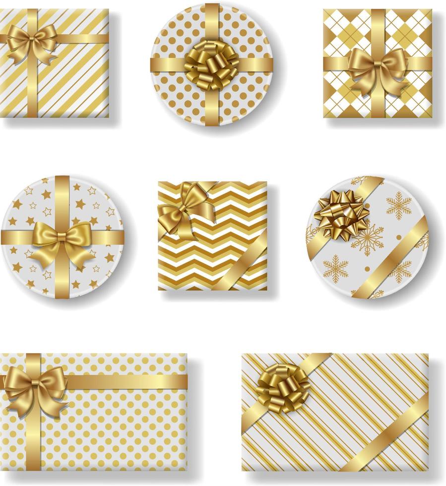 conjunto de cajas de regalo de navidad aisladas con lazo dorado vector