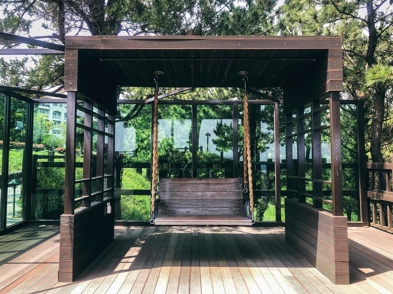 Wooden swings in a garden. Front view. Jeju island photo