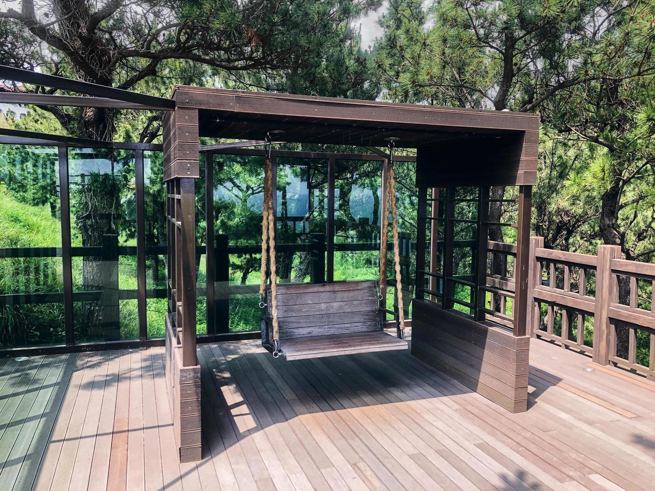 Wooden swings in a garden. Front view. Jeju island photo