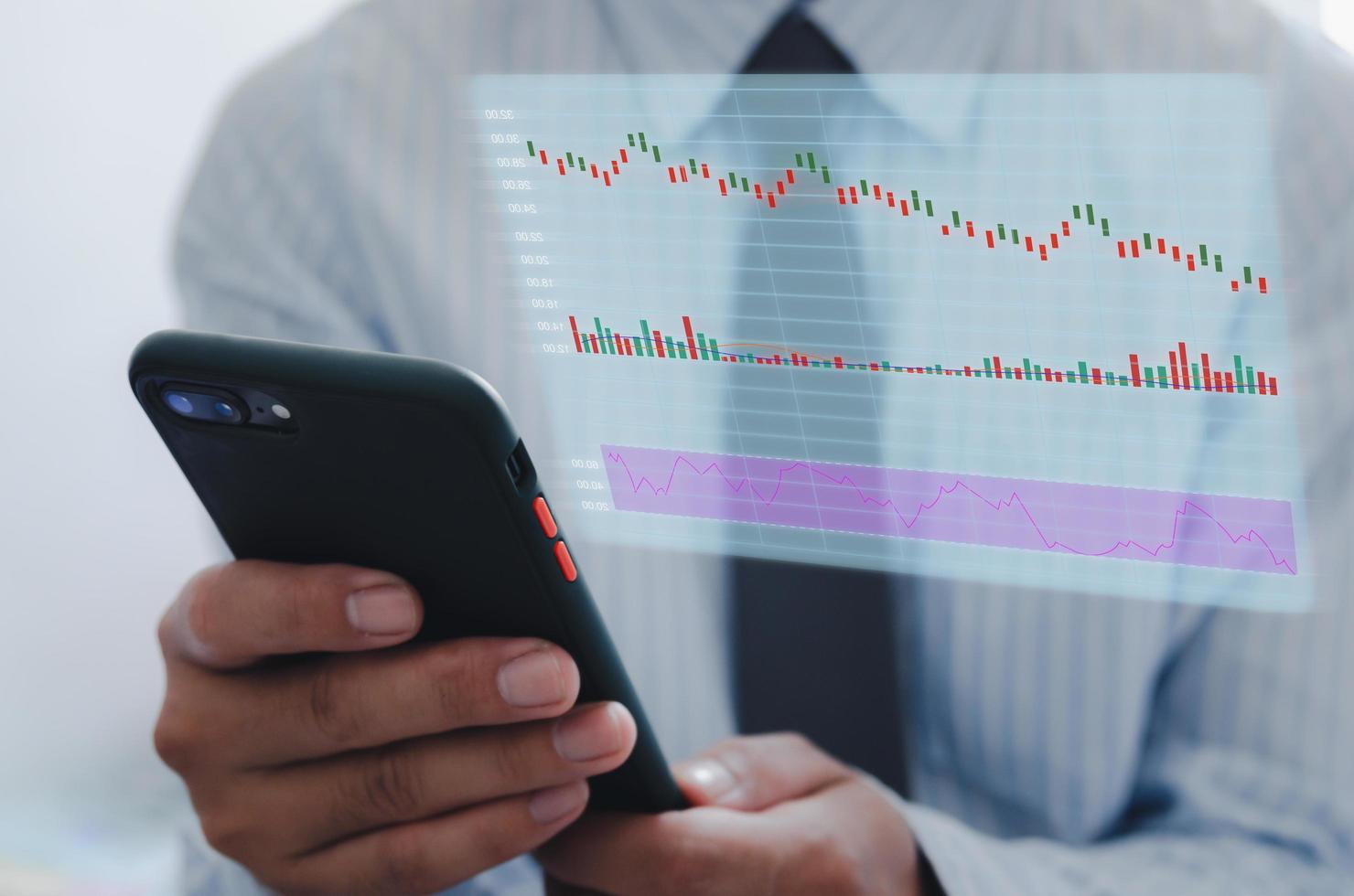 businessman using mobile phone to analyze stock market and economic growth chart with icons on a virtual screen. business strategy Finance and Banking digital marketing photo