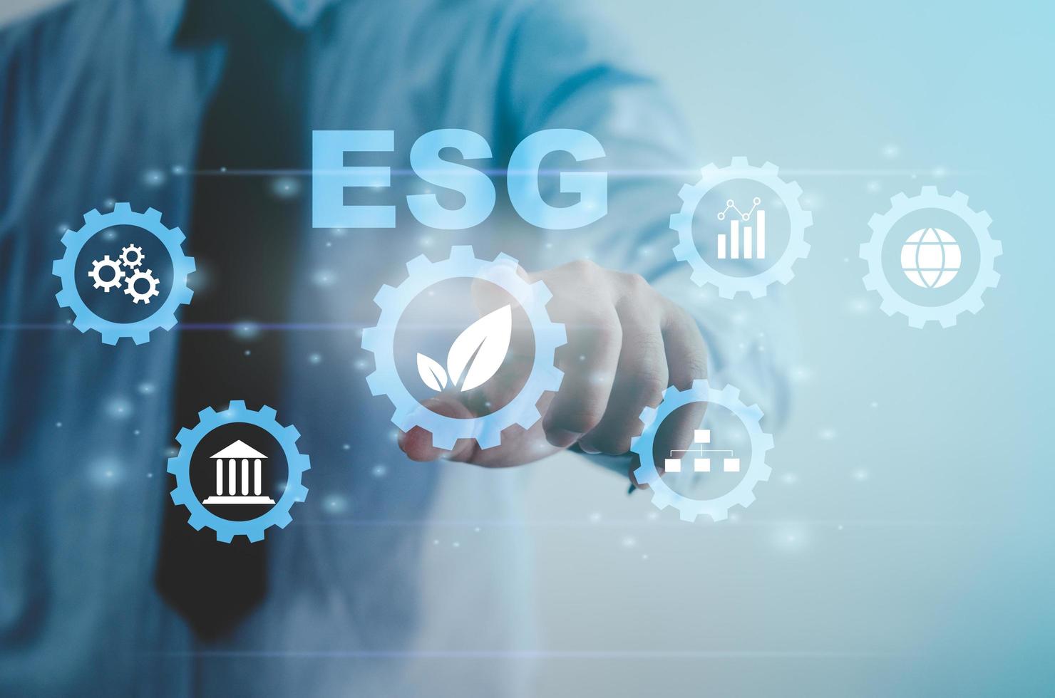 Environmental social and governance ESG investment Organizational growth that is sustainable is a business idea. A man's hand touches the ESG word on a virtual screen. photo