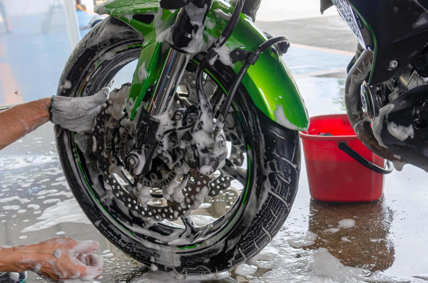 Wash the motorcycle at the car wash. photo