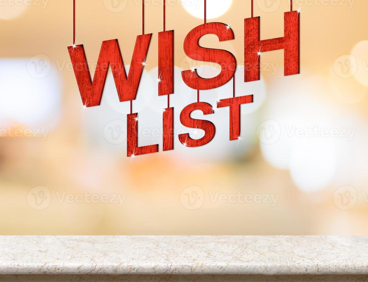 Wish list word hanging over marble table with blurred bokeh photo