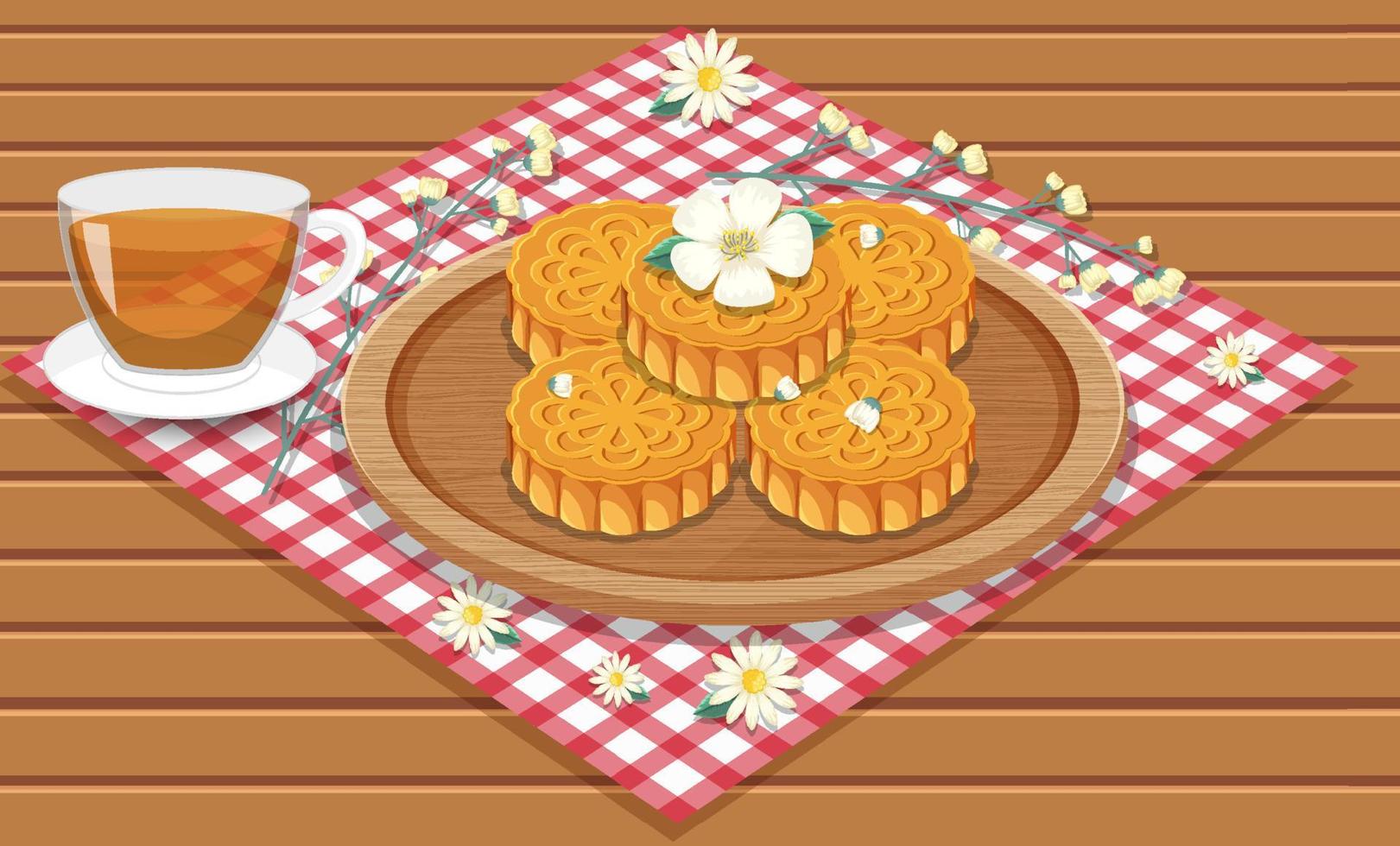 Montón de pasteles de luna con taza de té en mesa de madera vector