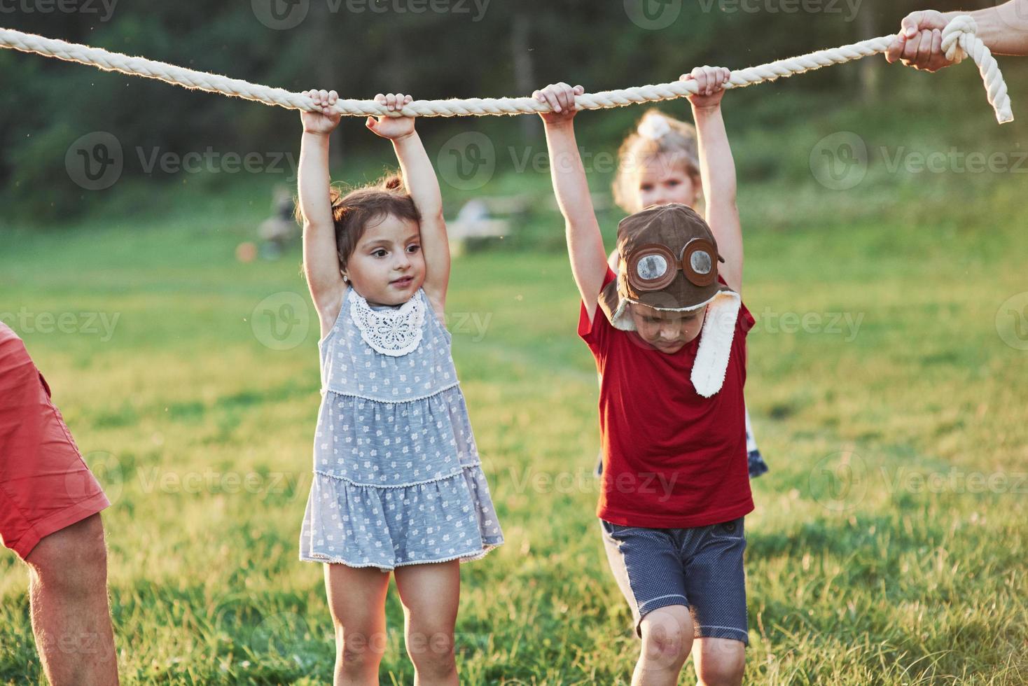 Interesting how much of us dad can hold on that rope. Pulling a rope game going so fun. Thats was is looks like to have good parents who like nature and action photo