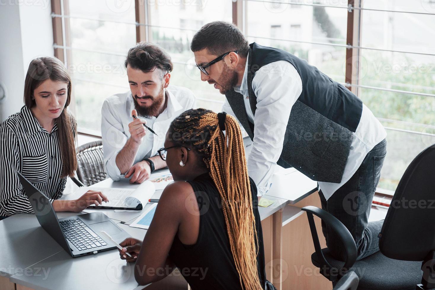 A group of multinational busy people working in the office photo