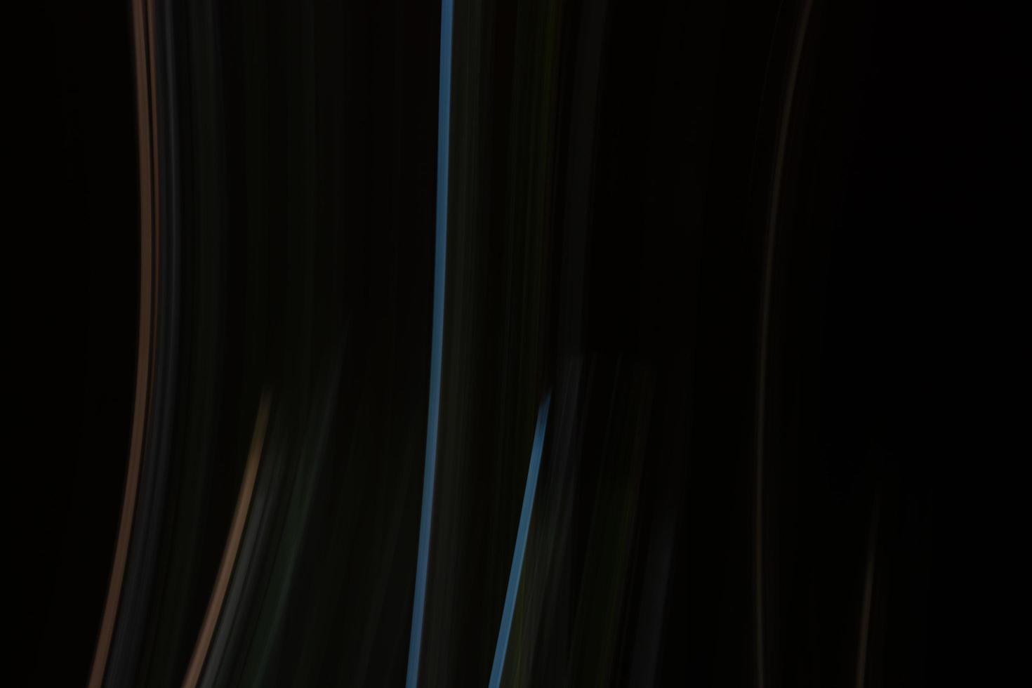 Abstract dark background with vertical multicolored lines. photo