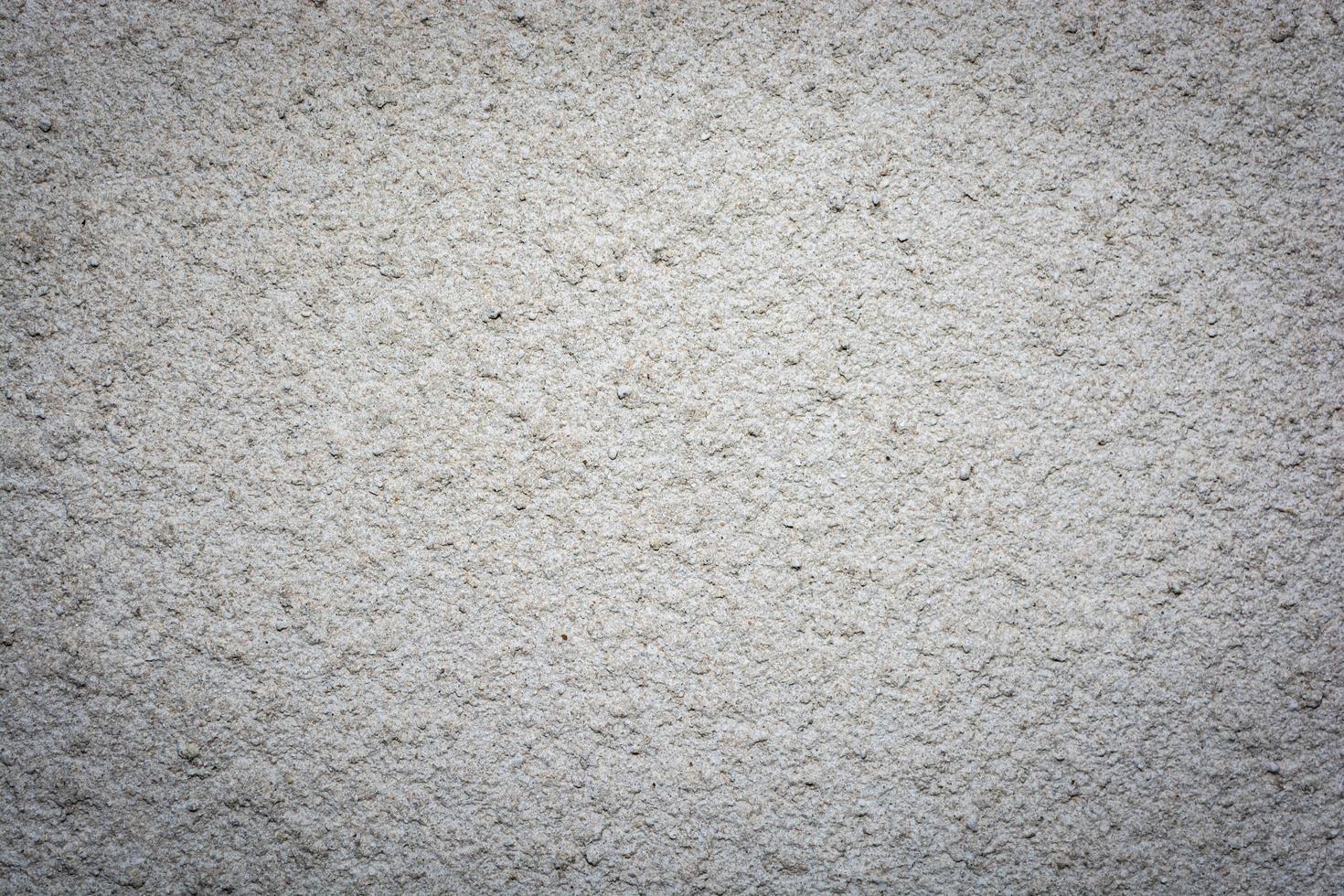 Concrete wall background covered with white rough cement mortar. photo