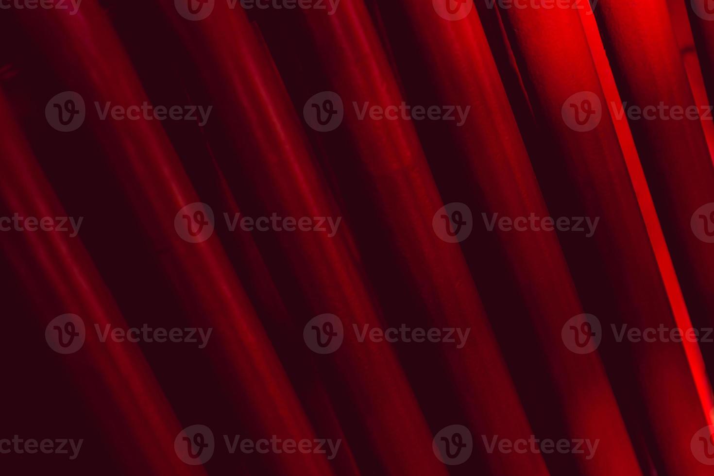 Abstract industrial background from pipes painted in red. photo