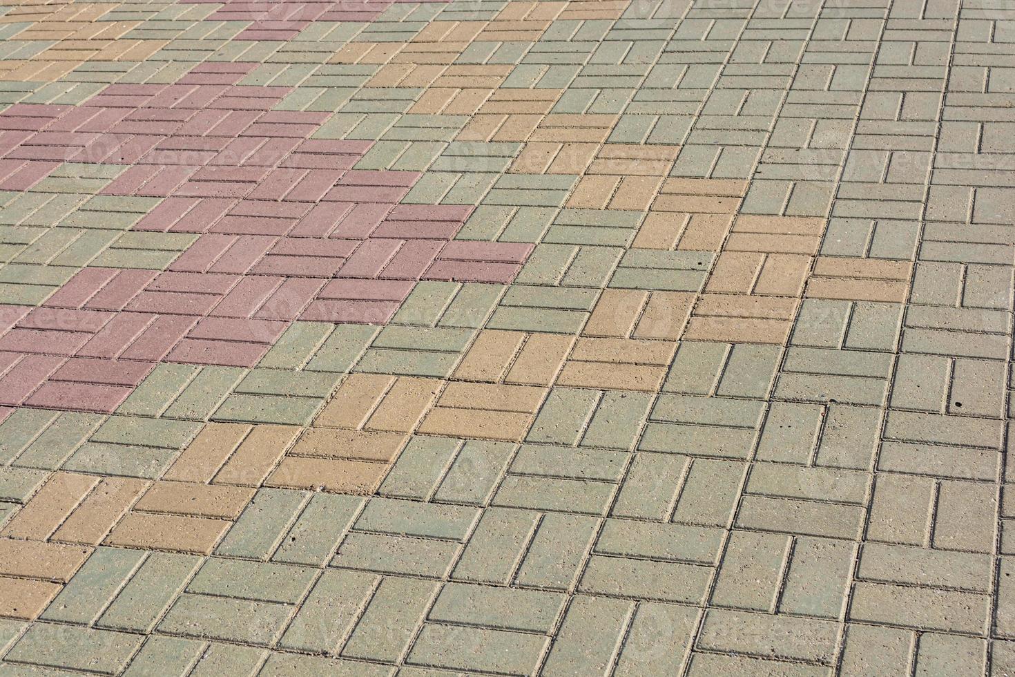 Multicolored background of paving slabs on a city street. photo