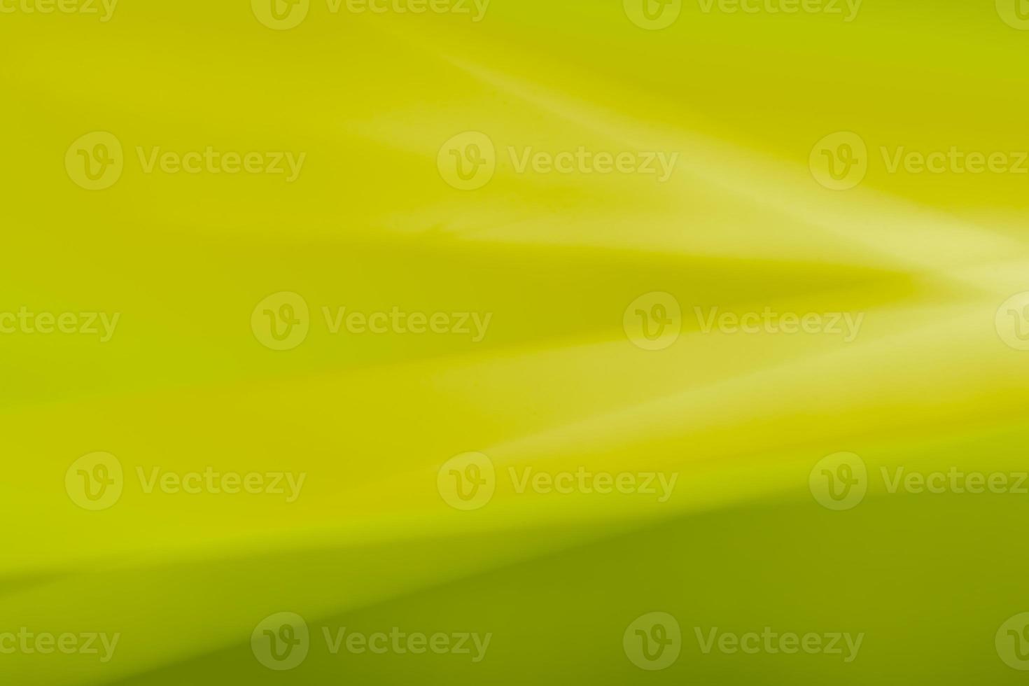 Abstract mustard green horizontal background made of bends, waves and highlights. photo