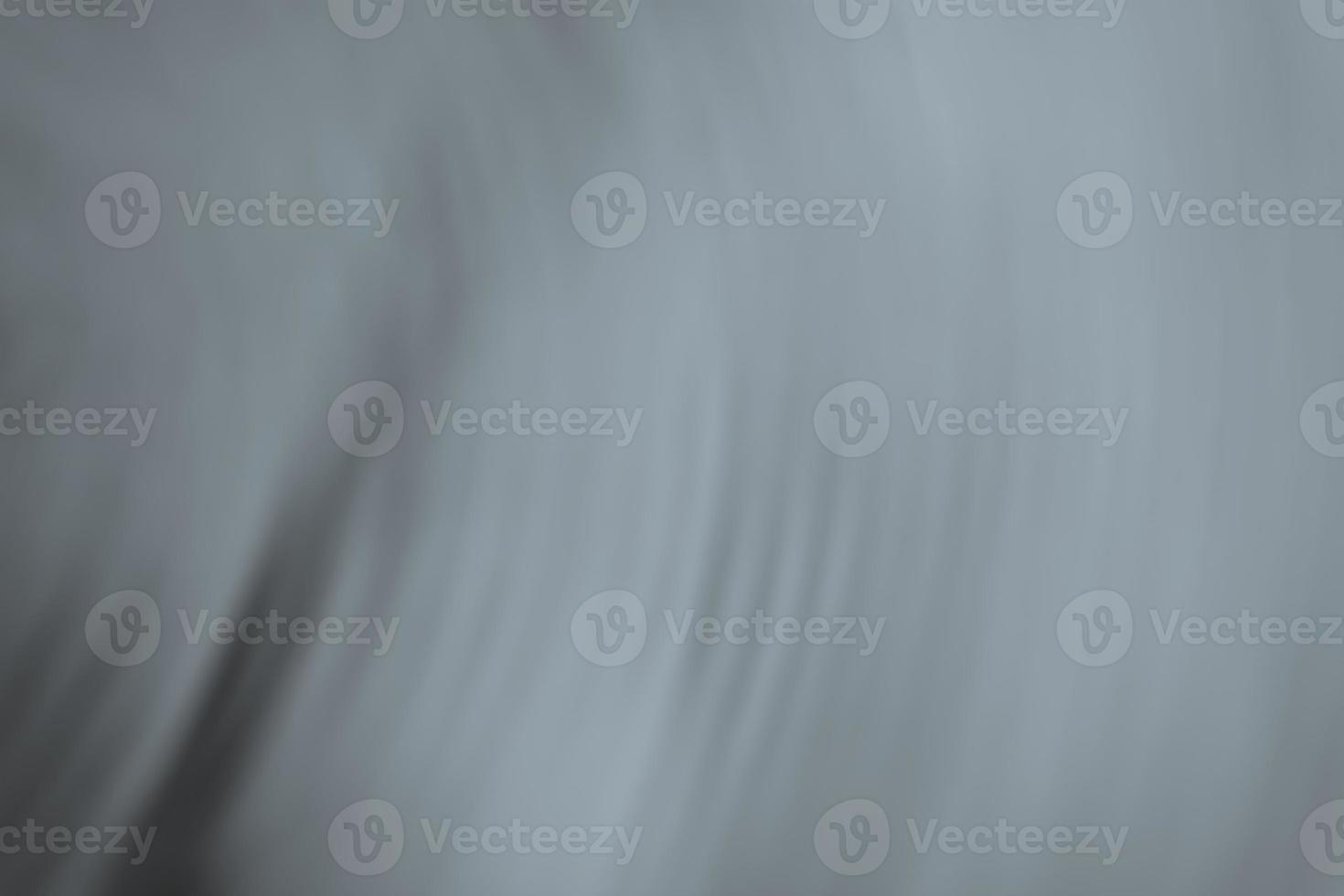 Gray abstract background. Blurred crumpled silk fabric. photo