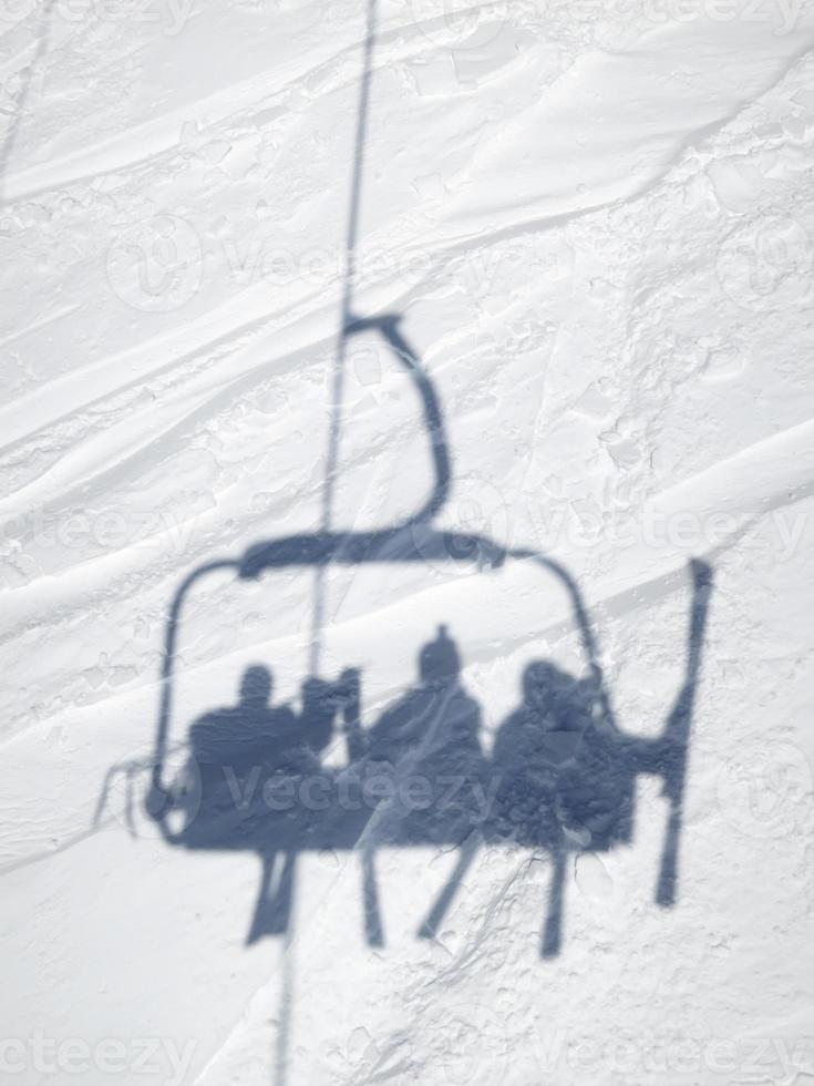 Shadow of ski lift chair photo