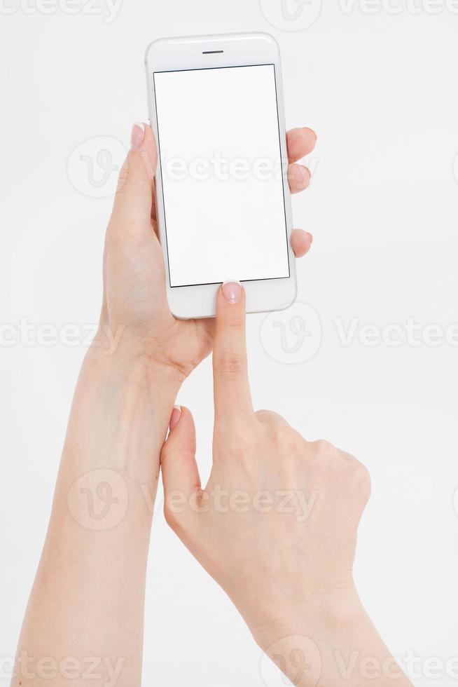 Hand holding white cellphone isolated on white clipping path inside. Online shopping. Top view. Mock up. Copy space. Template.Blank. photo