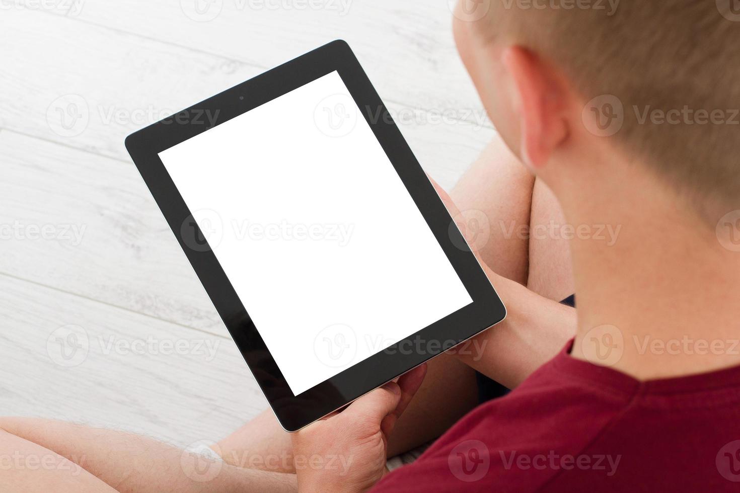 Man sitting with tablet in hands.Top view.Mock up.Copy space.Template.Blank. photo
