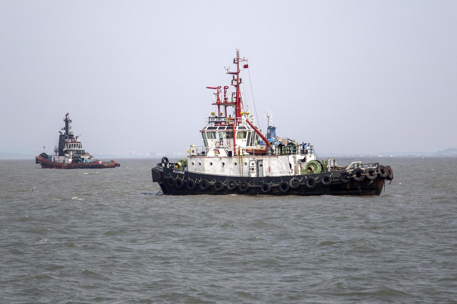 MUMBAI, INDIA, OCTOBER 11, 2015 - Industrial ship in the waters of Mumbai. The port and shipping industry employs many residents directly and indirectly. photo