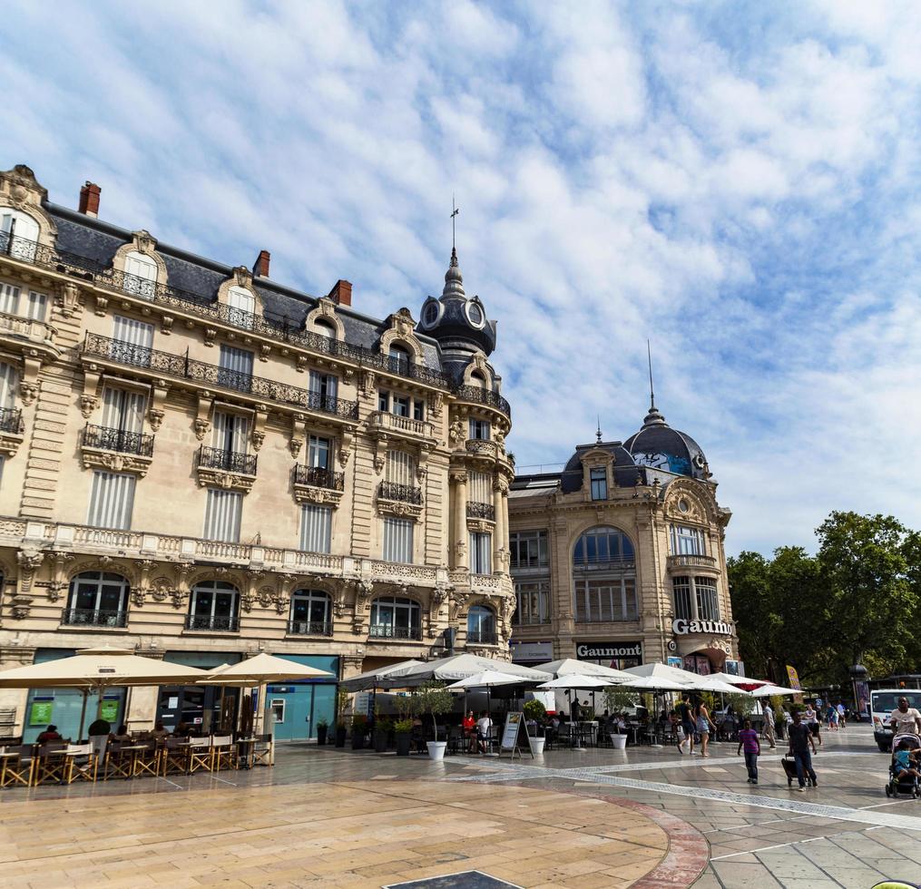 MONTPELLIER, FRANCE, JULY 13, 2015 - Unidentified people at Place de la Comedie in Montpeller, France. This square is the main focal point of the city of Montpellier. photo