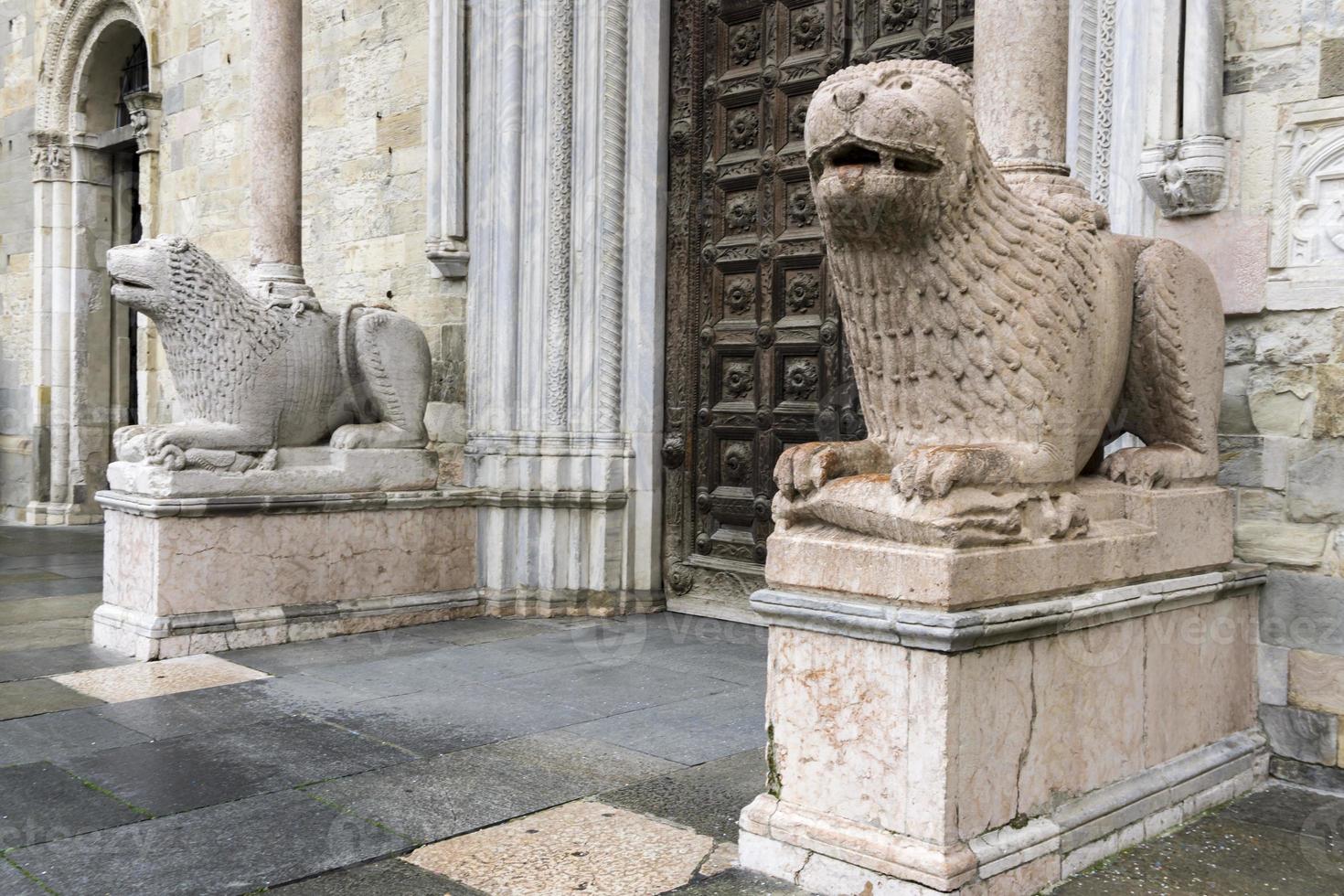 Lion statues in front of Parma Cathedral, Italy photo