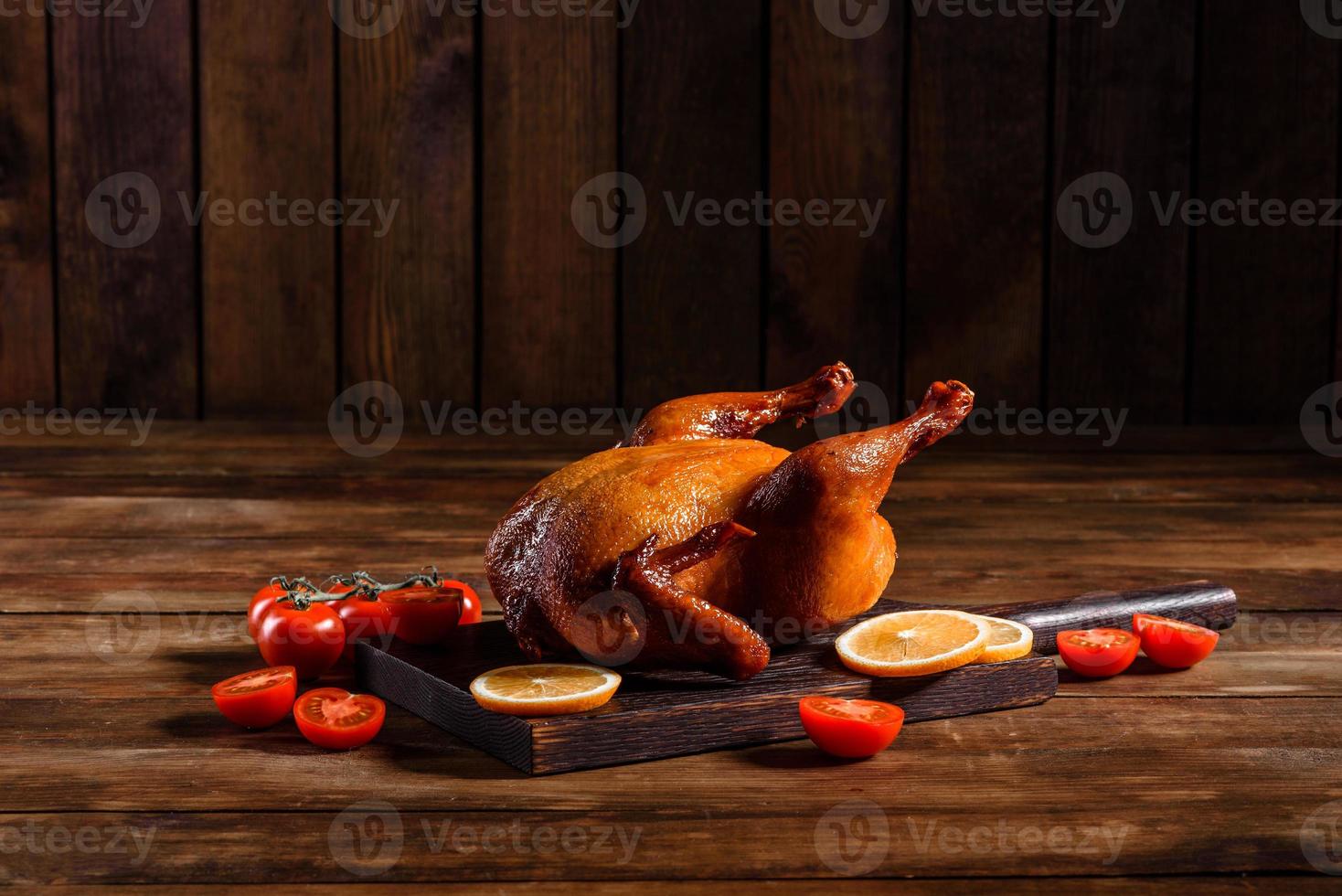 Tasty fresh baked turkey with spices and herbs for a family holiday table photo