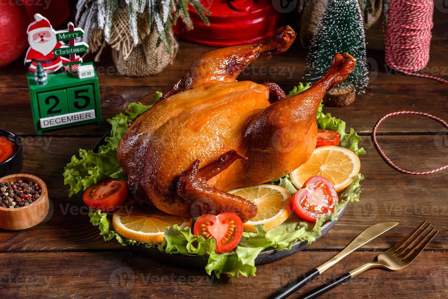 Tasty fresh baked turkey with spices and herbs for a family holiday table photo