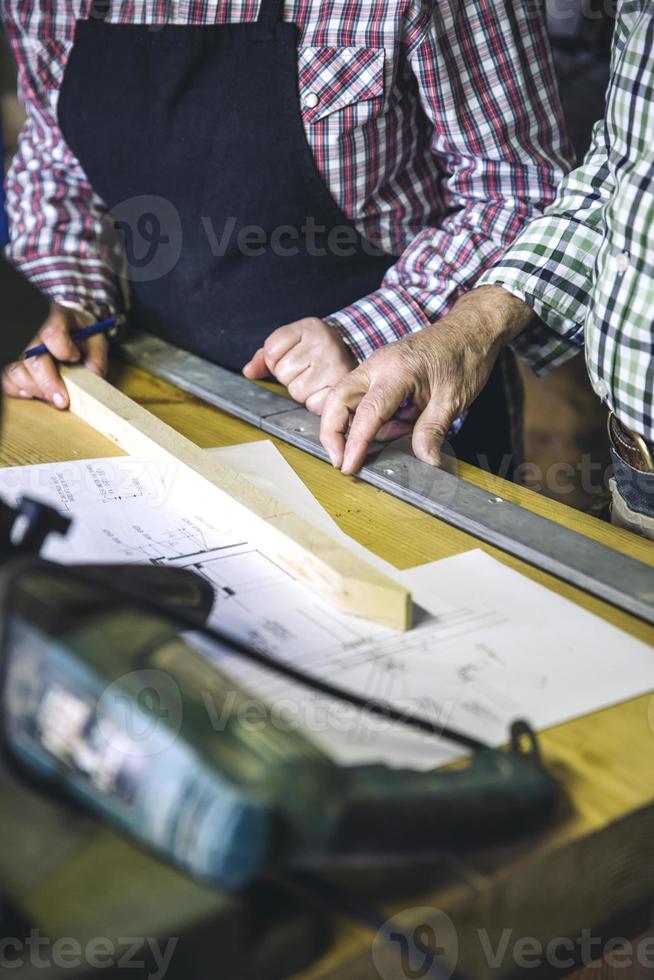 Unrecognizable senior couple in a carpentry photo