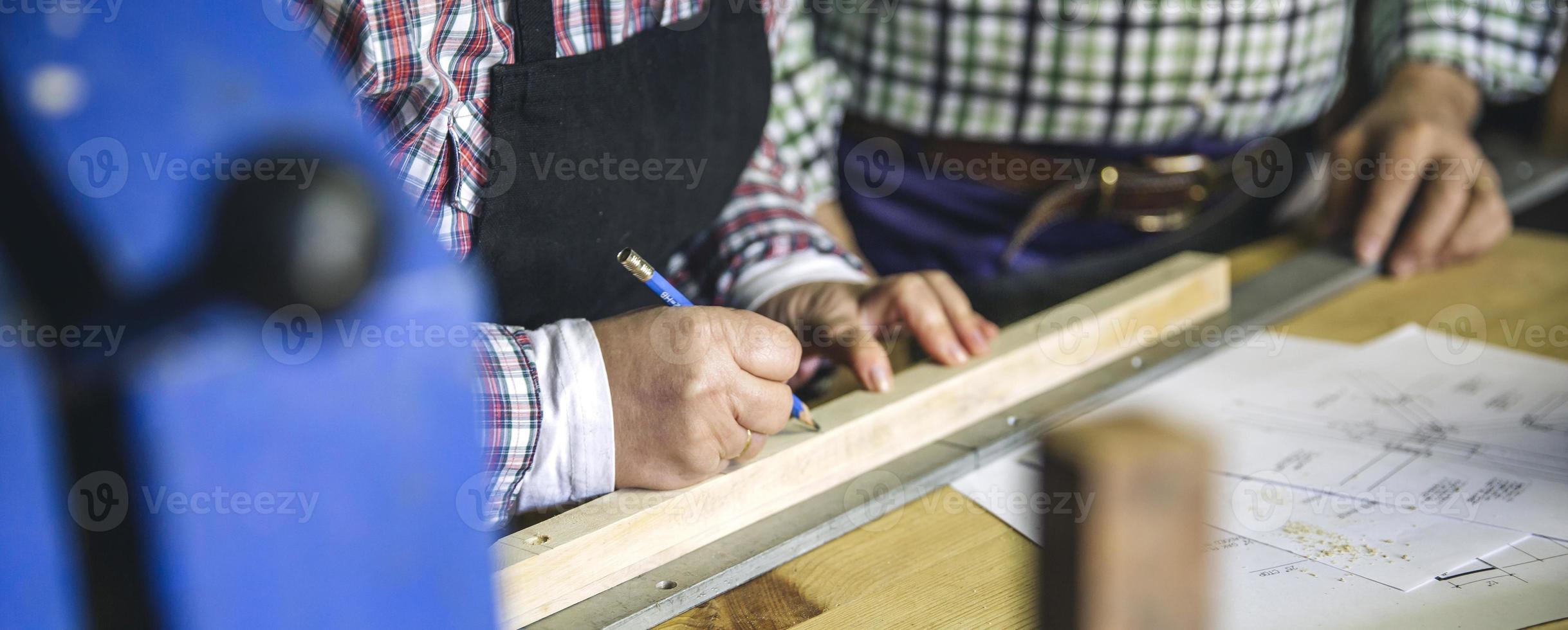 Unrecognizable senior couple in a carpentry photo