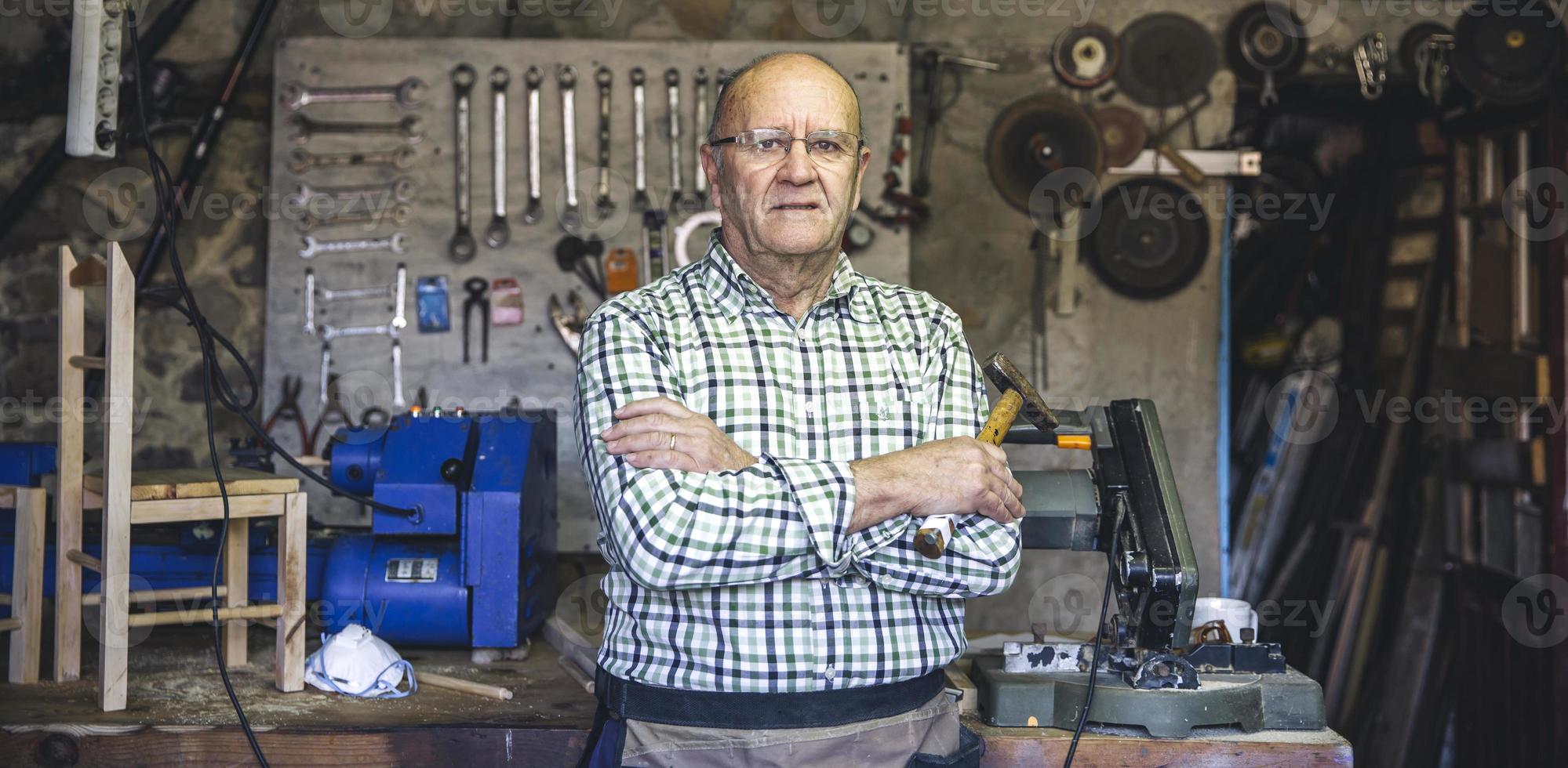 Carpenter in his workshop photo