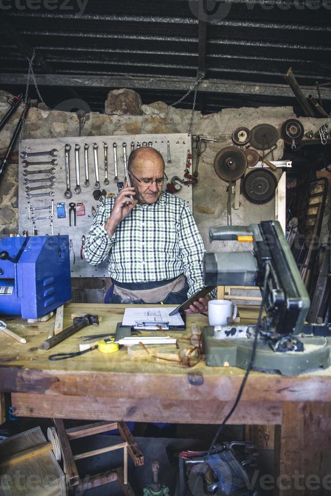 Carpenter in his workshop photo