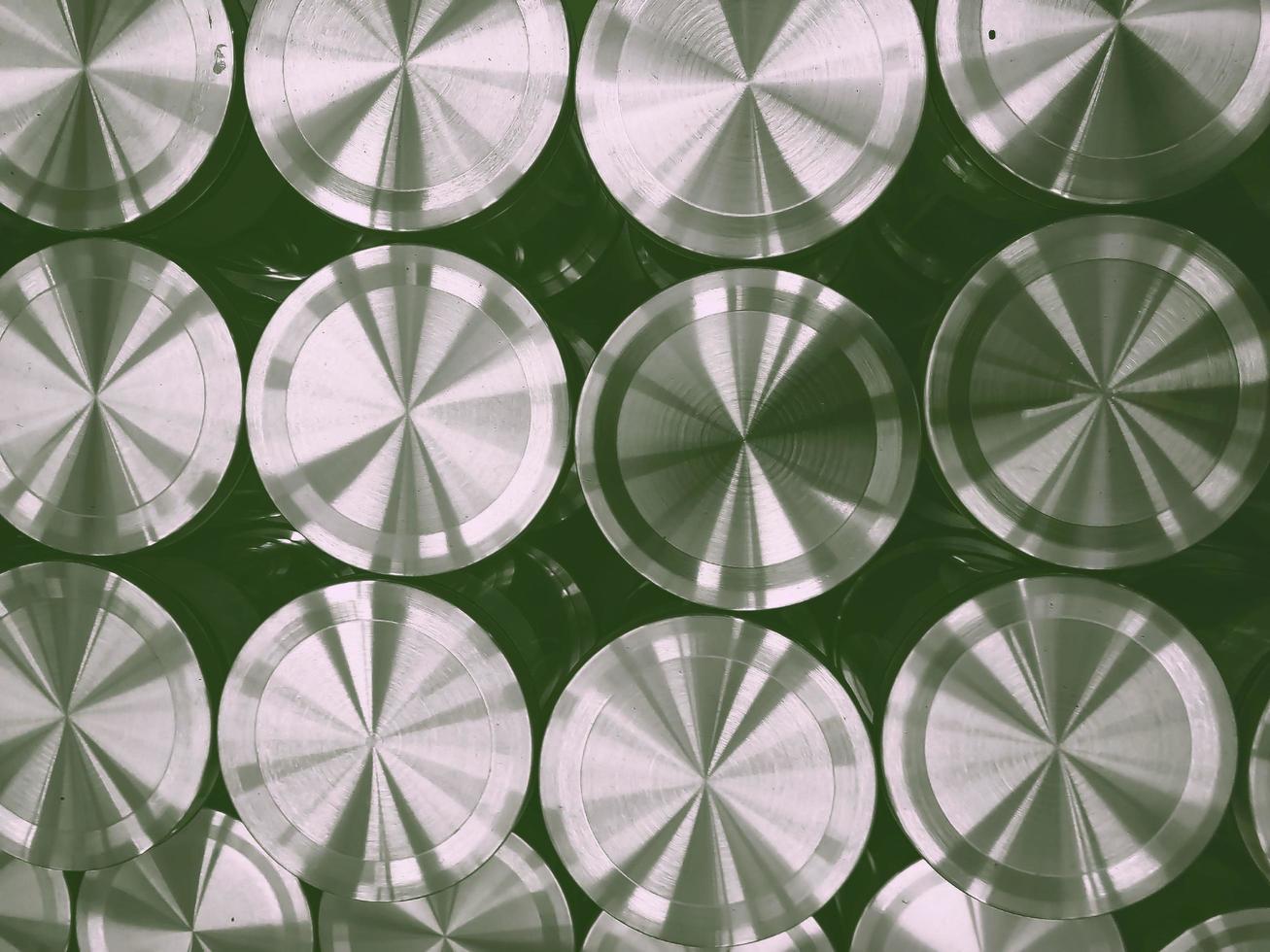 Brushed metal circle plate placed in a tight arrangement photo