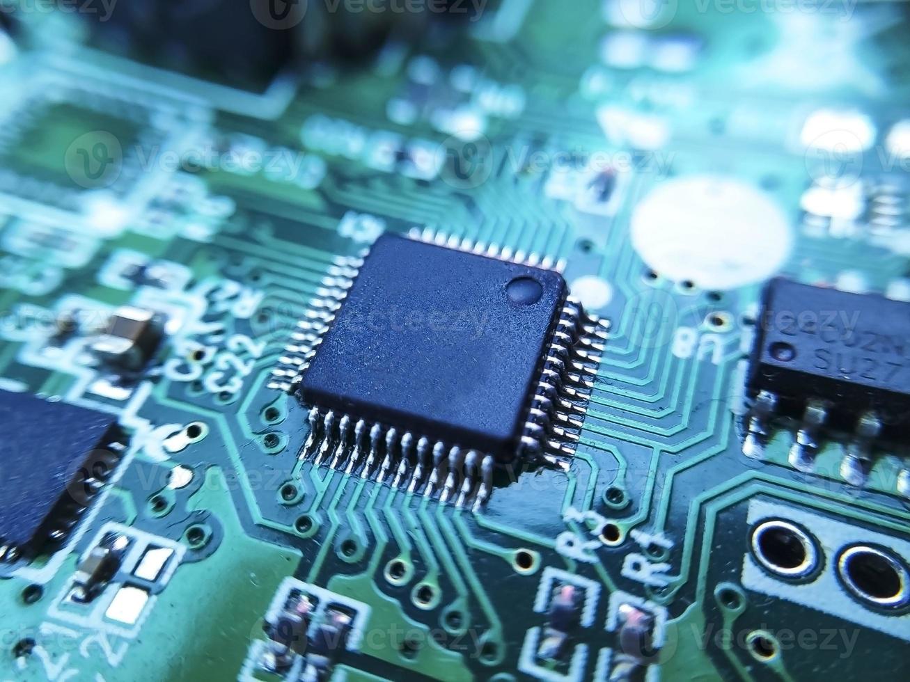 Close up image of microchip. Integrated circuit IC macro photograph. photo