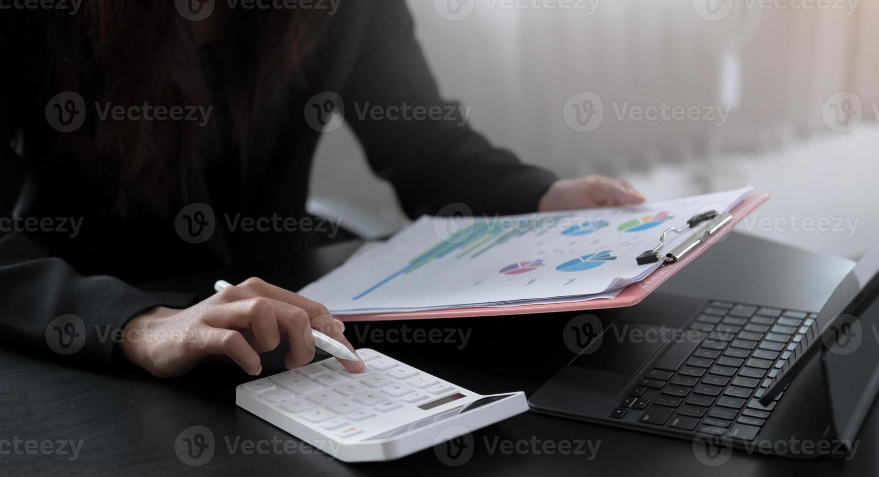 Close up view of bookkeeper or financial inspector hands making report, calculating or checking balance. Home finances, investment, economy, saving money or insurance concept photo