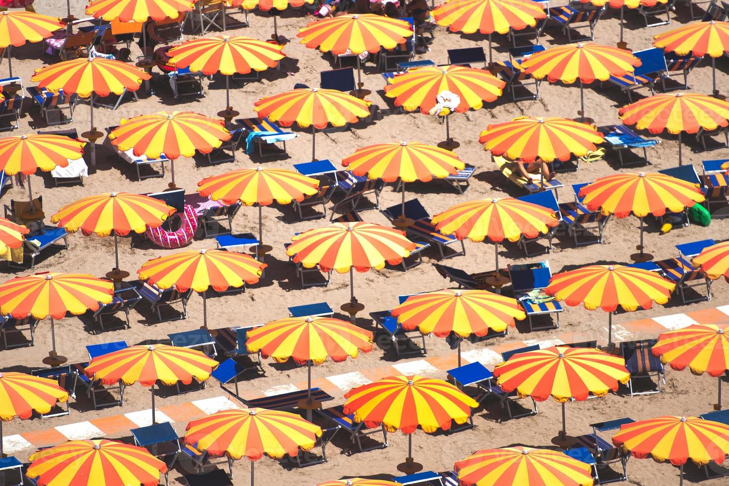 Detail of umbrellas on the beach on the Romagna coast in Italy photo