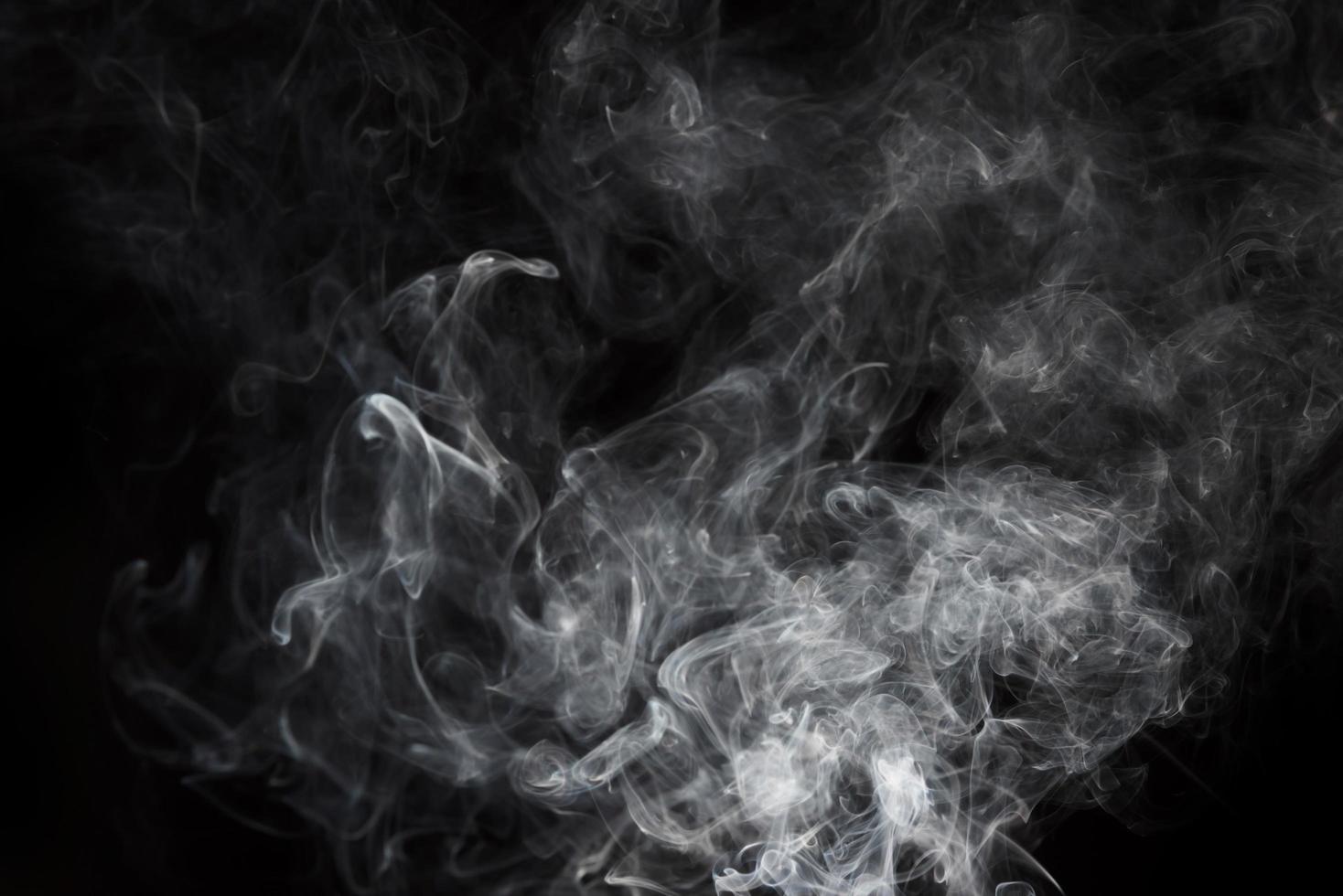 white smoke on black background photo