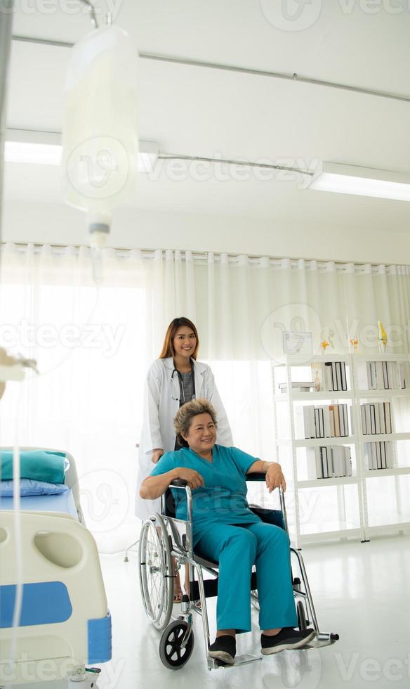 Female doctors perform disease tests and provide medical advice to senior patients that treatment. photo