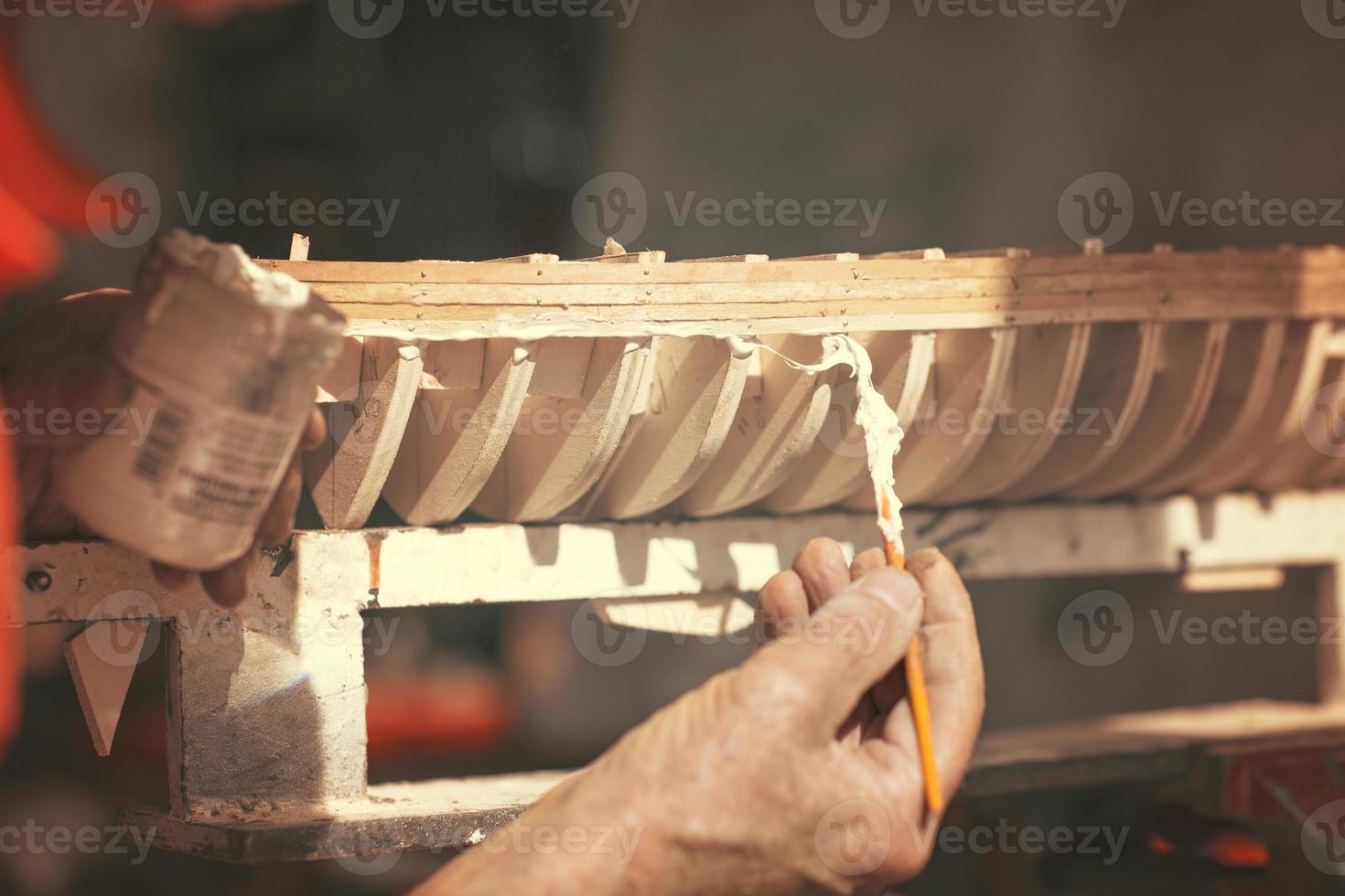 handcrafted craftwork of a wooden boat model photo