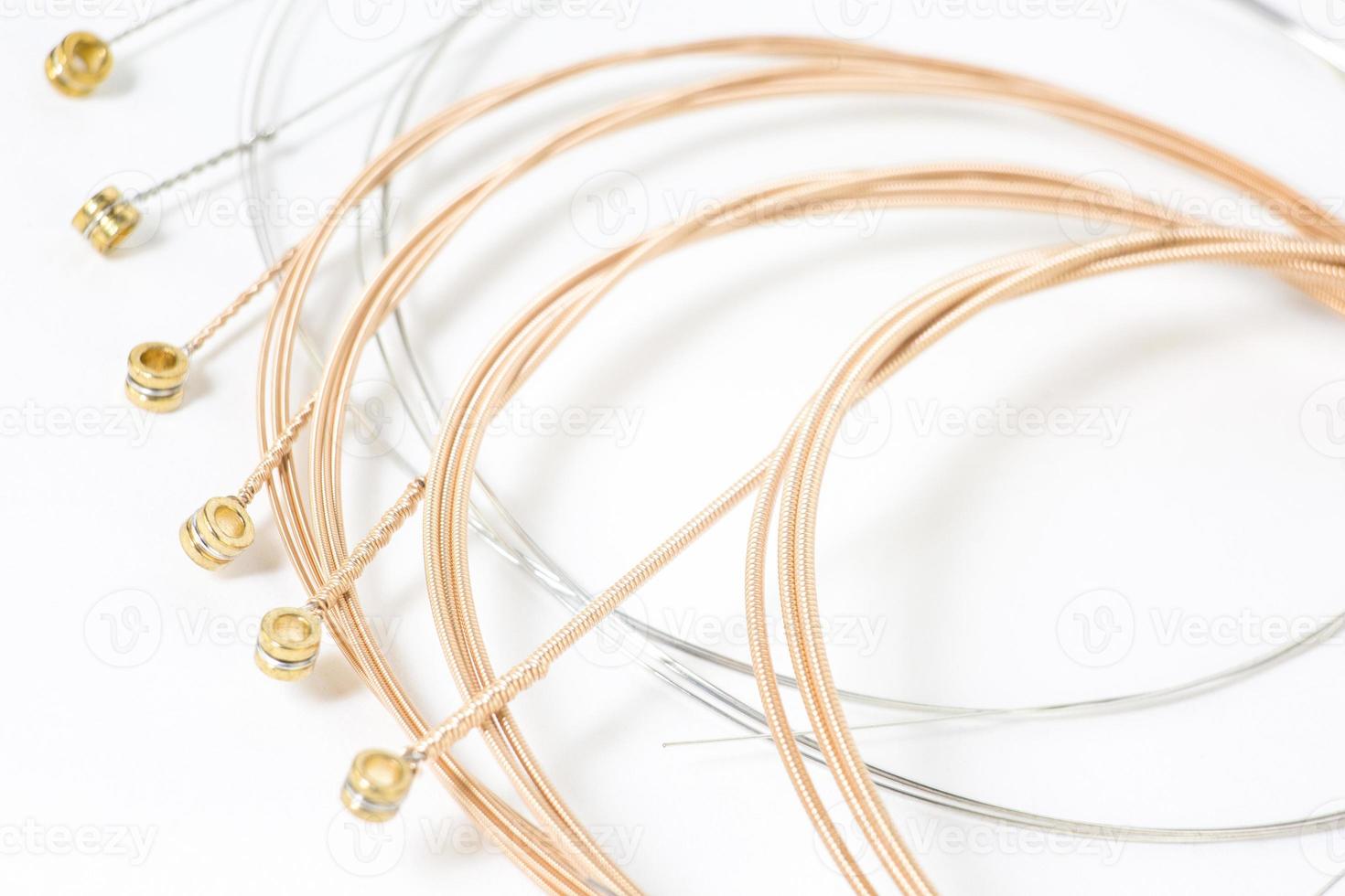 Set of bronze strings for acoustic guitar isolated photo