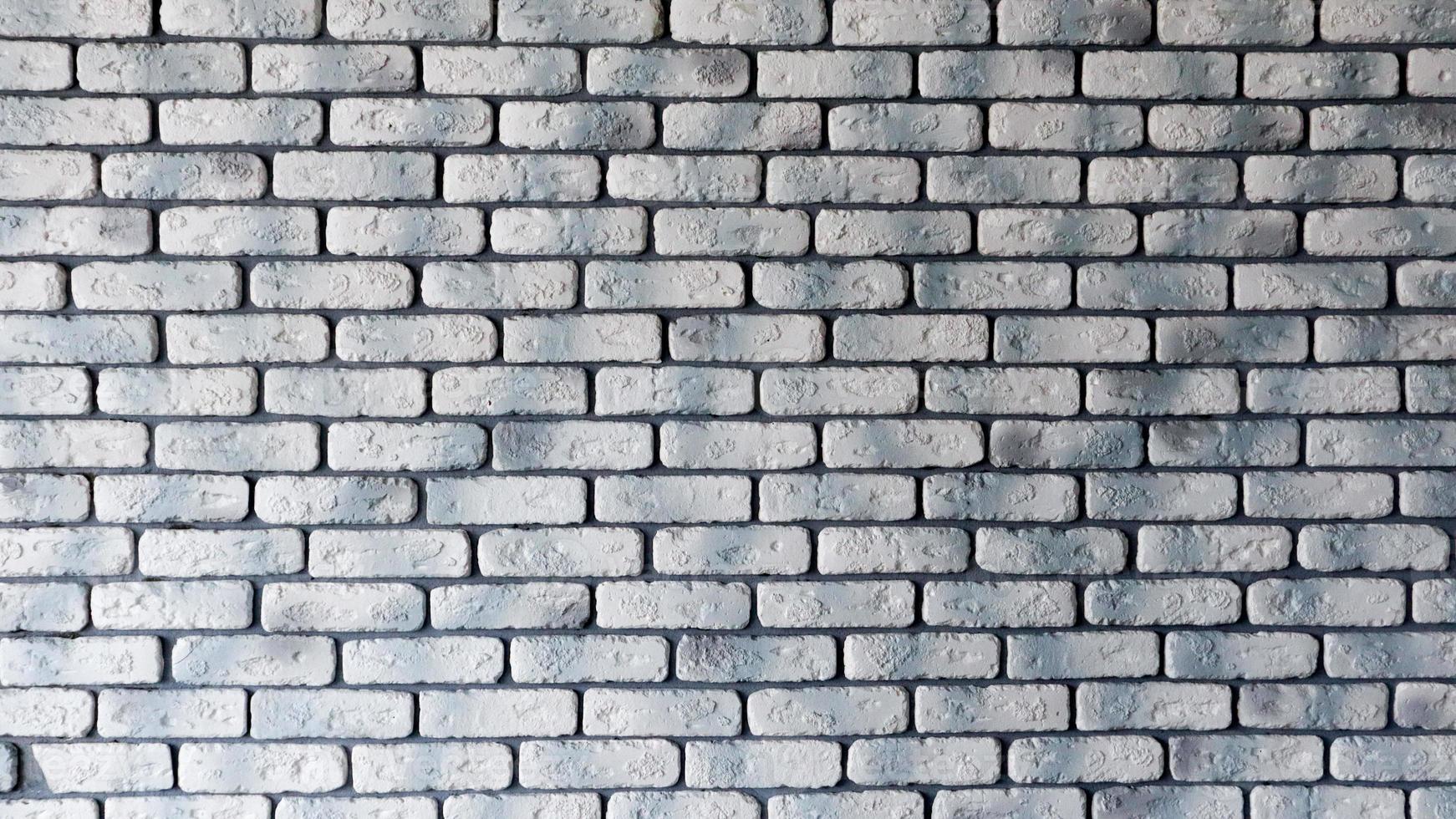 Modern white with gray brick wall texture for background. Abstract weathered texture painted with old stucco light gray and aged paint white brick wall background, grunge blocks of stone. photo