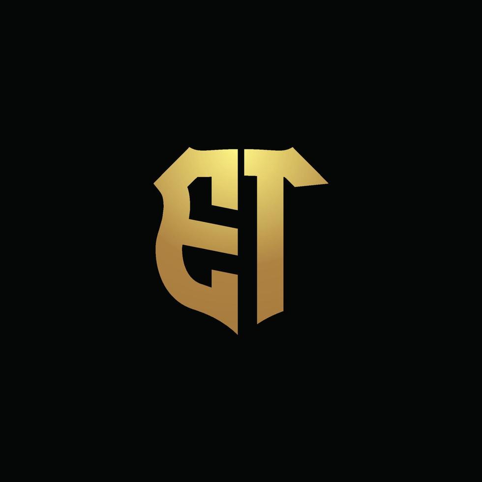 ET logo monogram with gold colors and shield shape design template vector