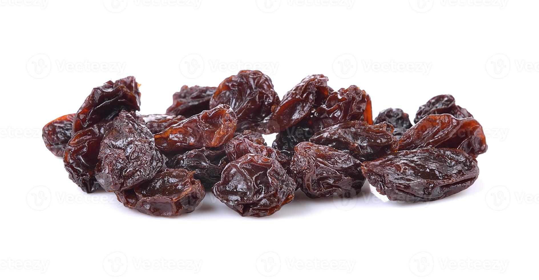 Dried raisins on a white background photo